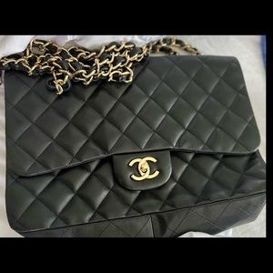 Black Chanel bag large shoulder and also cross body bag.
